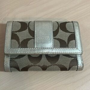 Coach trifold wallet. Tan/brown/metalic.